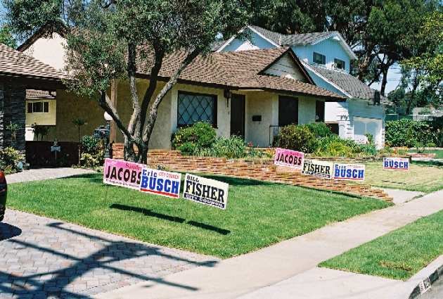 The El Segundo firefighters union installed double the campaign signs for City Council candidates Sandra Jacobs, Bill Fisher, and Eric Busch at a house on the east side of town.